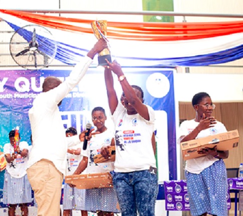 Dr Kingsley Kwame Agyemang (left), Registrar of the Ghana Scholarship Secretariat presenting the champions’ trophy to the winners, Kibi Senior High Technical School Dr Kingsley Kwame Agyemang (left), Registrar of the Ghana Scholarship Secretariat presenting the champions’ trophy to the winners, Kibi Senior High Technical School