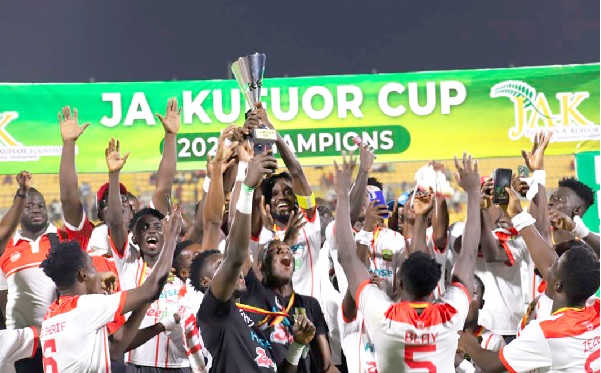 Kotoko captain Richmond Lamptey lifts the trophy as he celebrates the victory with his teammates Kotoko captain Richmond Lamptey lifts the trophy as he celebrates the victory with his teammates