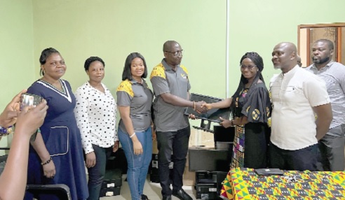 Peter Bosrotsi (4th from left), Manager, HR Risk & Operations, GCB Bank, presenting one of the computers to Sandra Asante, Head, Physiotherapy Department, Korle Bu Teaching Hospital Peter Bosrotsi (4th from left), Manager, HR Risk & Operations, GCB Bank, presenting one of the computers to Sandra Asante, Head, Physiotherapy Department, Korle Bu Teaching Hospital