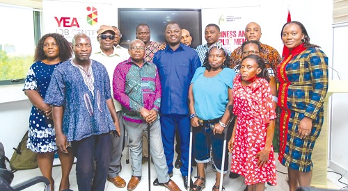 Kofi Baah Agyapong (middle), the Chief Executive Officer of YEA, with some PWDs after the meeting Kofi Baah Agyapong (middle), the Chief Executive Officer of YEA, with some PWDs after the meeting