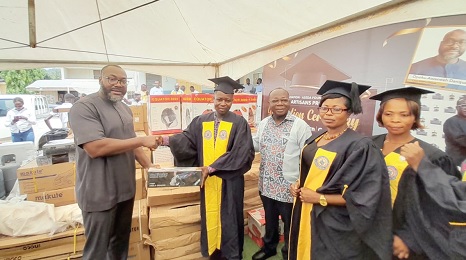 Opoku Awenee Danquah (left), Chief Executive Officer of GNPC, presenting one of the items to Emmanuel Kwaming from Adawso. Looking on are Freddie Blay, the Board Chairman of GNPC, and other graduands Opoku Awenee Danquah (left), Chief Executive Officer of GNPC, presenting one of the items to Emmanuel Kwaming from Adawso. Looking on are Freddie Blay, the Board Chairman of GNPC, and other graduands