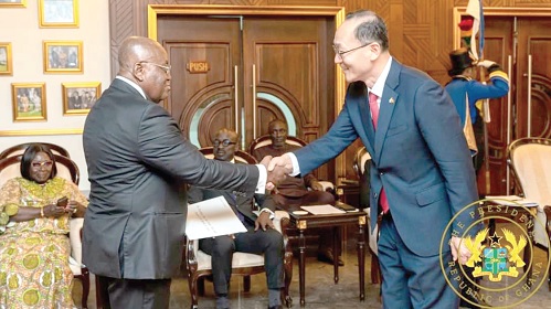 Park Kyongsig, the Korean Ambassador to Ghana, in a handshake with the President after presenting his credentials