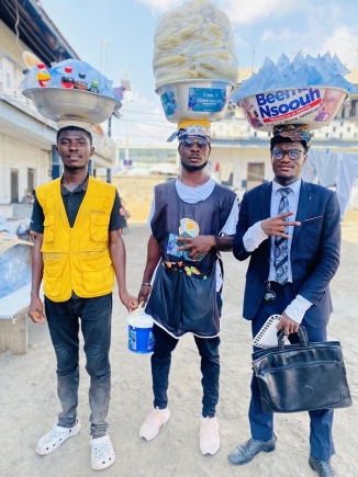 Mr Antwi (right) with his other hawkers  Mr Antwi (right) with his other hawkers