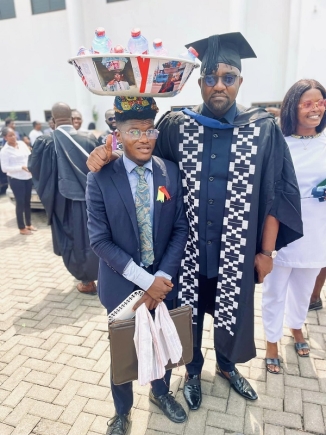 Through his hustle, Ernest has met some celebrities including, actor, John Dumelo (right) Through his hustle, Ernest has met some celebrities including, actor, John Dumelo (right)