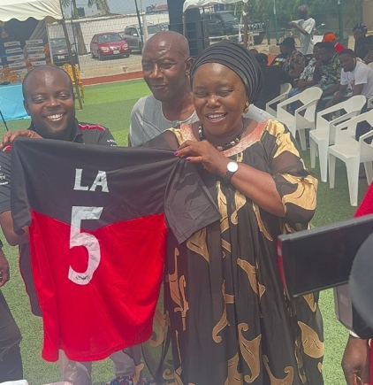 Rita Naa Odoley Sowah, Member of Parliament for La Dade Kotopon, inspecting a jersey at the launch Rita Naa Odoley Sowah, Member of Parliament for La Dade Kotopon, inspecting a jersey at the launch