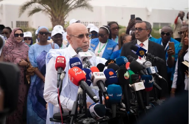 President Mohamed Ould Cheikh El Ghazouani speaks to reporters after casting his vote at a polling station in Nouakchott, Mauritania President Mohamed Ould Cheikh El Ghazouani speaks to reporters after casting his vote at a polling station in Nouakchott, Mauritania