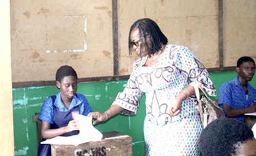 Wendy Enyonam Addy-Lamptey (right), Head of National Office of WAEC, Ghana, checking the material of a candidate at the Burma Camp Junior High School during her visit to the examination hall Wendy Enyonam Addy-Lamptey (right), Head of National Office of WAEC, Ghana, checking the material of a candidate at the Burma Camp Junior High School during her visit to the examination hall