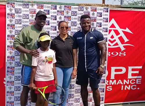 Former tennis star Enoch Godi (far right) with boxer Freezy MacBones and MP Zanetor Rawlings at the clinic. Former tennis star Enoch Godi donates $25,000 worth of equipment to tennis clubs