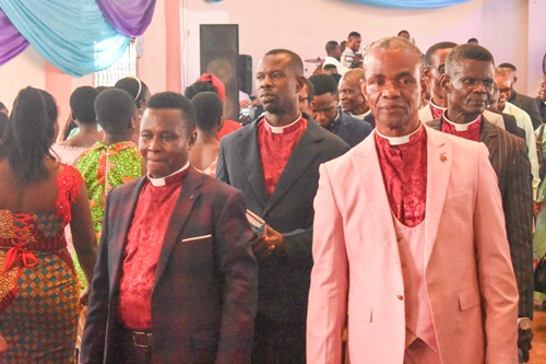 Rev. Charles Takyi  ( left), General Secretary of Dispensation Gospel Mission, Ghana, processing with other Ministers to the ceremony
