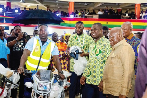 President Akufo-Addo (right) and Kofi Baah Agyepong (2nd from right), CEO, YEA, interacting with one of the beneficiaries President Akufo-Addo (right) and Kofi Baah Agyepong (2nd from right), CEO, YEA, interacting with one of the beneficiaries