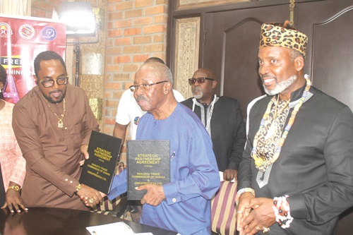 Prof. Hugh Keku Aryee (left), Vanuatu Trade Commissioner to Ghana, and Kwaw Paintsil Ansah (2nd from right), Founder and Chief Executive Officer, Film Africa Studios, exchanging the agreement after launching the ONEAFRIQUE24 in Accra. With them is King Rex Timothy McPherson Semako I & VI (right), President of the Africa Diaspora Central Bank & Chairman of ECO-6. Picture: ESTHER ADJORKOR ADJEI Prof. Hugh Keku Aryee (left), Vanuatu Trade Commissioner to Ghana, and Kwaw Paintsil Ansah (2nd from right), Founder and Chief Executive Officer, Film Africa Studios, exchanging the agreement after launching the ONEAFRIQUE24 in Accra. With them is King Rex Timothy McPherson Semako I & VI (right), President of the Africa Diaspora Central Bank & Chairman of ECO-6. Picture: ESTHER ADJORKOR ADJEI