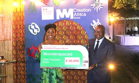 Natalie Fordwor (left), Founder of Wonderspaced, receiving a cheque for €30,000 from Jules-Armand Aniambossou, French Ambassador to Ghana Natalie Fordwor (left), Founder of Wonderspaced, receiving a cheque for €30,000 from Jules-Armand Aniambossou, French Ambassador to Ghana