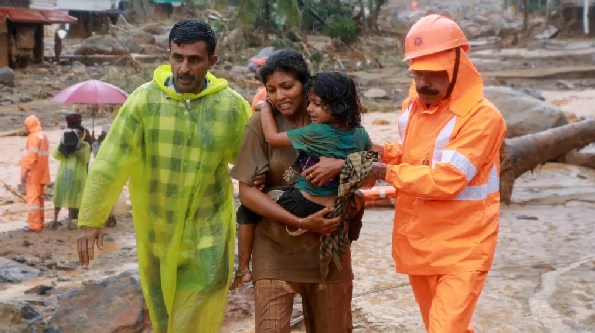 Rescuers help residents move to safety Rescuers help residents move to safety
