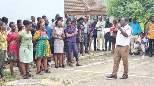 ADO1 Isaac Tengfaa explaining a point during the fire safety training session with staff of the Graphic Communications Group Ltd