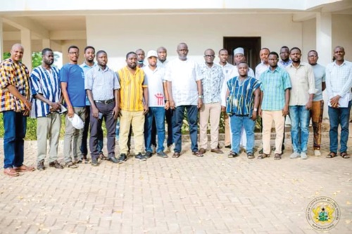 Dr Hafiz Bin Salih (middle), Upper East Regional Minister, with some media practitioners after the engagement