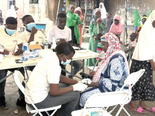 Medical personnel attending to some residents