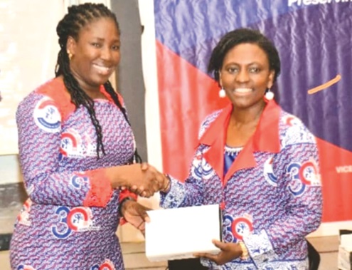 Napaga Tia Sulemana (left) receiving the award from Obaa Yaa Amponsah, President of NPP-USA Chapter Napaga Tia Sulemana (left) receiving the award from Obaa Yaa Amponsah, President of NPP-USA Chapter