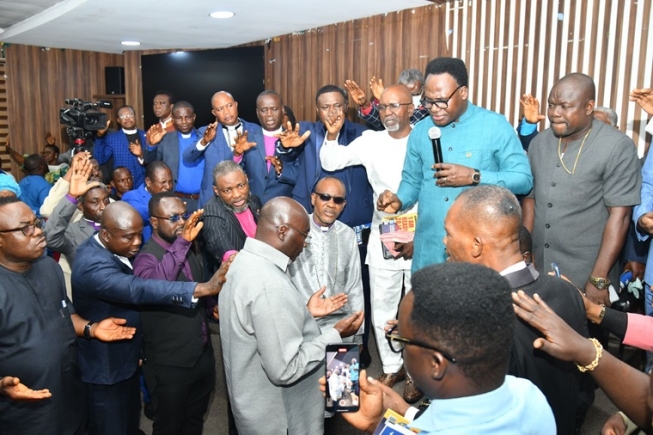 Members of the clergy praying for Dr Mahamudu Bawumia (arrowed), the NPP flag bearer, after their meeting in Accra Members of the clergy praying for Dr Mahamudu Bawumia (arrowed), the NPP flag bearer, after their meeting in Accra