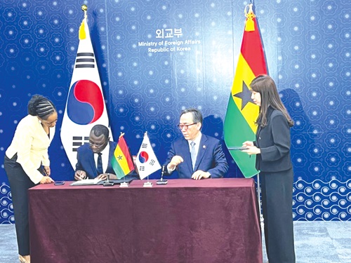 Dr Mohammed Amin Adam (2nd from left), Finance Minister, and Cho Tae-Yeol, Foreign Minister, South Korea, signing the agreement Dr Mohammed Amin Adam (2nd from left), Finance Minister, and Cho Tae-Yeol, Foreign Minister, South Korea, signing the agreement