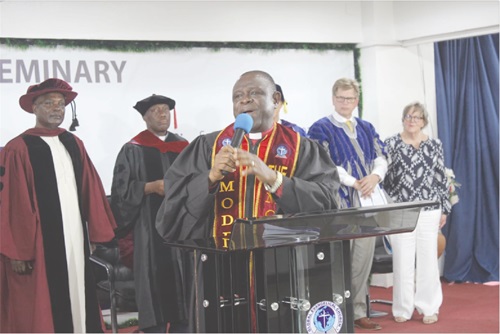 Rt Rev. Prosper Samuel Dzomeku, Moderator, Global Evangelical Church, addressing the congregation and graduates as Professor Samson Kwaku Agodzo (left), Chairman of the Governing Council; Rev. Dr K. A. Hiagbe (2nd from left) and John Anderson (right) look on Rt Rev. Prosper Samuel Dzomeku, Moderator, Global Evangelical Church, addressing the congregation and graduates as Professor Samson Kwaku Agodzo (left), Chairman of the Governing Council; Rev. Dr K. A. Hiagbe (2nd from left) and John Anderson (right) look on