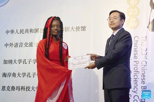 Lilian Ama Serwaa Tobias receiving her prize from Li Yang, the Minister-Counselor at the Chinese Embassy Lilian Ama Serwaa Tobias receiving her prize from Li Yang, the Minister-Counselor at the Chinese Embassy