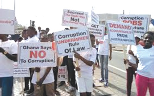 Some placard-bearing youth advocating an end to corruption in Ghana Some placard-bearing youth advocating an end to corruption in Ghana