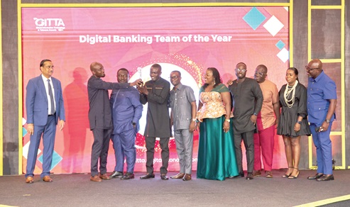 GCB Bank staff displaying one of the 2024 GITTA awards