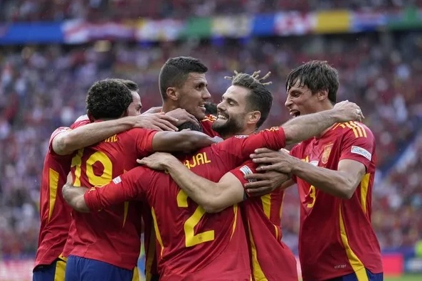 The Spanish players celebrating their victory over Croatia The Spanish players celebrating their victory over Croatia