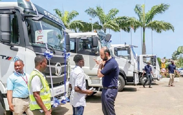 An official of Japan Motors (right) explaining the features of the trucks to a journalist Japan Motors holds 5th Foton stakeholder engagement in Tamale