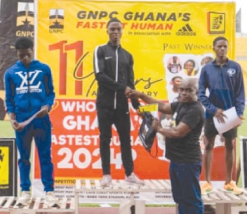 Hamza Abubakar (middle) receiving his award after the race Hamza Abubakar (middle) receiving his award after the race