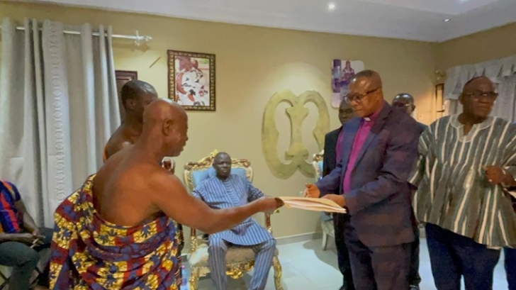 Ejura Akyeamehene on behalf of Nana Ejurahene presenting the land document to Rev. Charles Oppong-Poku, Vice President of Ghana Baptist Convention