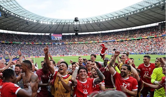 Switzerland's Dan Ndoye, Steven Zuber and teammates celebrate their victory over Italy. Switzerland's Dan Ndoye, Steven Zuber and teammates celebrate their victory over Italy.