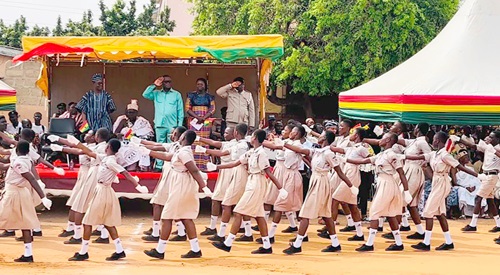 Kofi Ofori (arrowed), MCE for Ablekuma North Assembly, taking the salute while pupils of Odorkor Maclean Basic School march past Kofi Ofori (arrowed), MCE for Ablekuma North Assembly, taking the salute while pupils of Odorkor Maclean Basic School march past