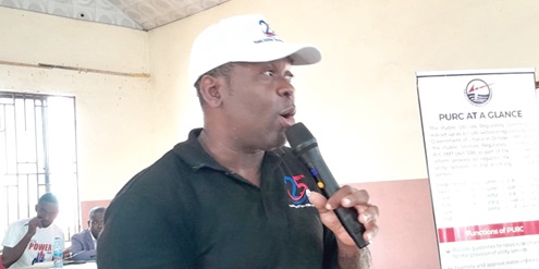 Jude Aduamoah-Addo (left), Eastern Regional Manager of the Public Utilities Regulatory Commission, addressing consumers of electricity and water at Asamankese Jude Aduamoah-Addo (left), Eastern Regional Manager of the Public Utilities Regulatory Commission, addressing consumers of electricity and water at Asamankese