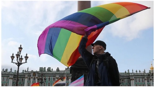 A participant waves a rainbow flag during the St Petersburg Pride in 2019. Today, the flag would be considered a "symbol of extremism" A participant waves a rainbow flag during the St Petersburg Pride in 2019. Today, the flag would be considered a "symbol of extremism"