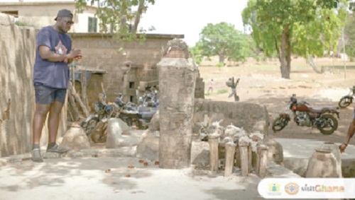 A tourist on a tour of one of the shrines