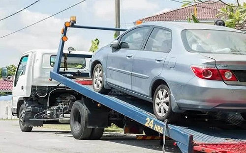 FILE PHOTO: A car on towing vehicle FILE PHOTO: A car on towing vehicle