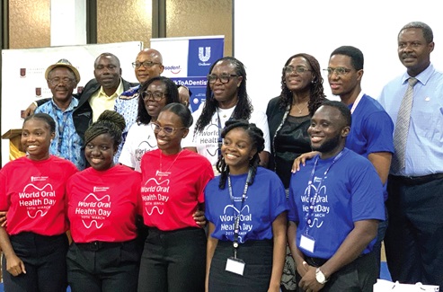 The winners (in red shirts), co-debaters (blue shirts) with some facilitators The winners (in red shirts), co-debaters (blue shirts) with some facilitators