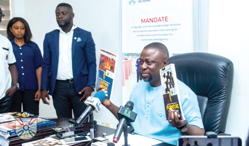Dr Fred Kyei Asamoah displaying the Competency-Based Training curricula at the media engagement Dr Fred Kyei Asamoah displaying the Competency-Based Training curricula at the media engagement