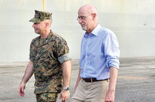 USS Hershel ‘Woody’ Williams, the warship. INSET: Ambassor Robert Scott (right), Deputy Commander for Civil-Military Engagement, and Lt Colonel Jarrad S. Caola, his Executive Officer, during the tour of the USS Hershel ‘Woody’ Williams which berthed at the Tema Port. Picture: BENJAMIN XORNAM GLOVER