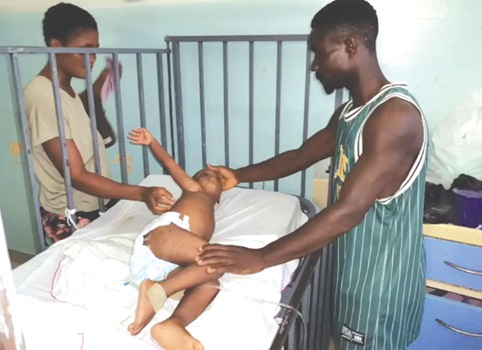 The child mauled by the dog receiving attention at the hospital The child mauled by the dog receiving attention at the hospital