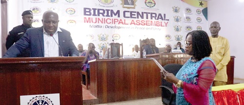Joyce Adjoa Agyeiwaa (standing right) swearing the oath of office being administered by Seth Kwame Acheampong, the Eastern Regional Minister (left) Joyce Adjoa Agyeiwaa (standing right) swearing the oath of office being administered by Seth Kwame Acheampong, the Eastern Regional Minister (left)