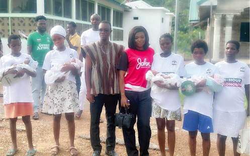 Joycelyn Tetteh (middle) with some of the mothers and their babies Joycelyn Tetteh (middle) with some of the mothers and their babies
