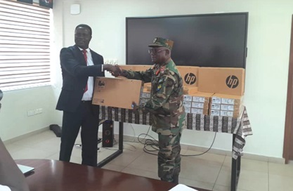 Brigadier General Barima Brako Owusu (right), Chief Staff Officer, Army Headquarters, receiving one of the laptops from Dr Yaw Osei Adutwum, Education Minister Brigadier General Barima Brako Owusu (right), Chief Staff Officer, Army Headquarters, receiving one of the laptops from Dr Yaw Osei Adutwum, Education Minister