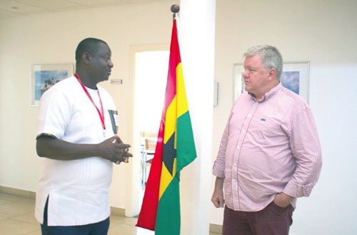 Tom Nørring (right) in an interaction with Samuel Doe Ablordeppey, News Editor of the Daily Graphic