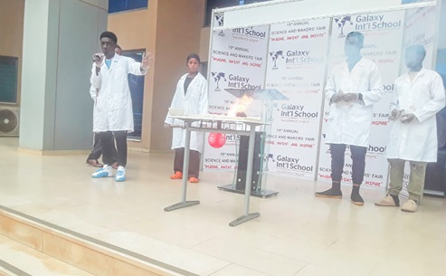 Students of Galaxy International School explaining an experiment at the 19th Annual Science and Makers' Fair Students of Galaxy International School explaining an experiment at the 19th Annual Science and Makers' Fair