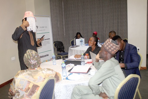 Anas Aremeyaw Anas, investigative journalist, interacting with some journalists during the training workshop.   Picture: ESTHER ADJORKOR ADJEI 
