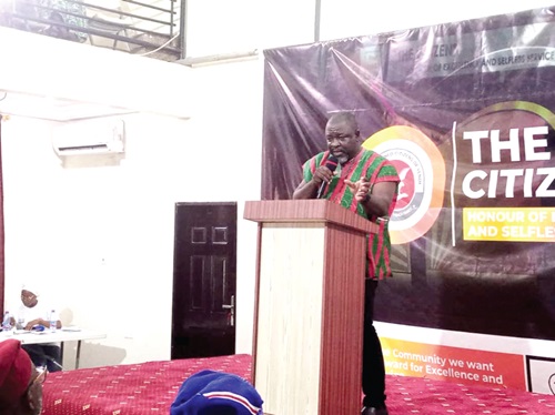 Some of the awardees. INSET: Nathaniel Adams Junior, Development Expert, speaking at the event