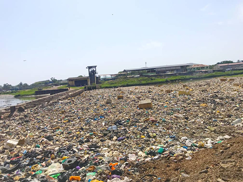 Culverts at the point the Odaw River empties into the sea is heavily choked with plastic and electronic waste