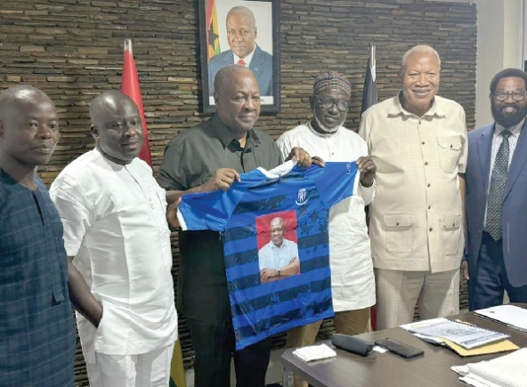 Former President Mahama being presented a replica jersey with his name embossed on it Former President Mahama being presented a replica jersey with his name embossed on it